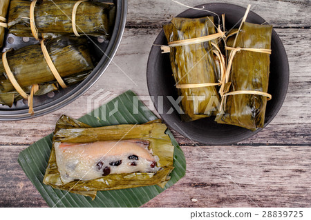 Streamed sticky rice, black bean in banana leaf . 28839725