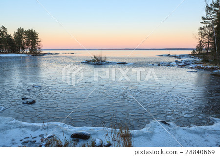 Ice blocks on freezing lake at dusk Ice blocks on freezing lake at dusk 28840669