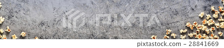 Popcorn on a concrete background, top view Popcorn on a concrete background, top view 28841669