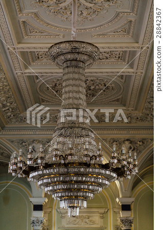 图库照片: large vintage crystal chandelier in the palace