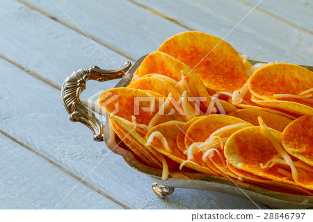 Natural potato chips on wood background Natural potato chips on wood background 28846797