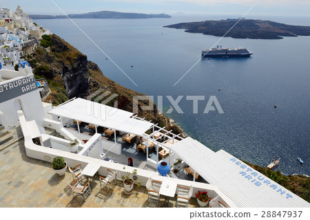 The view on Fira town and tourists The view on Fira town and tourists 28847937