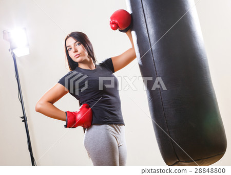 sports girl in boxing gloves and body punching bag sports girl in boxing gloves and body punching bag 28848800