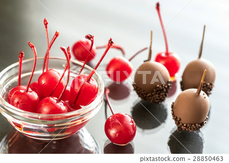 Chocolate and cocktail cherries on the glass 28850463