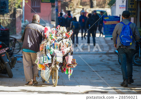 Nepalese merchant sell equipment on the bicycle  28856021