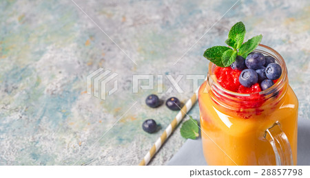 Mango drink and blueberries copy space Mango drink and blueberries copy space 28857798