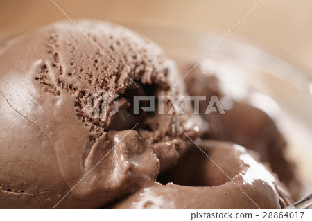 chocolate ice cream in glass bowl on wooden table 28864017