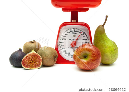 kitchen scales and fruit on a white background 28864612