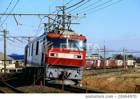 Electric locomotive towing a cargo train 28864970