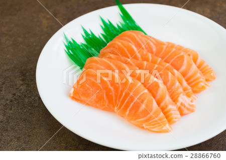 Sliced raw salmon on white plate Sliced raw salmon on white plate 28866760