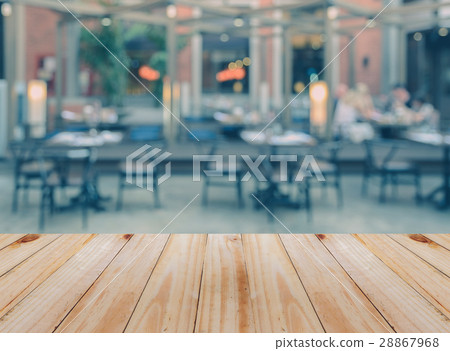 Wooden table with blurred restaurant background 28867968