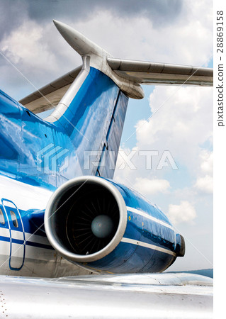 Engine and tail detail of business jet airplane 28869158