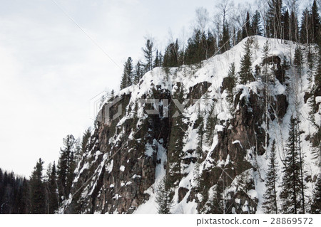 top of snowy mountain forest roa. use a smart  28869572