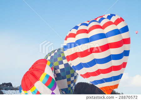 Hot air balloon dancing in the winter sky 28870572