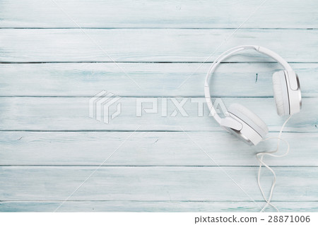 White headphones for music sound on wooden table 28871006