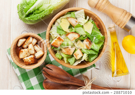 Fresh healthy caesar salad cooking Fresh healthy caesar salad cooking 28871010