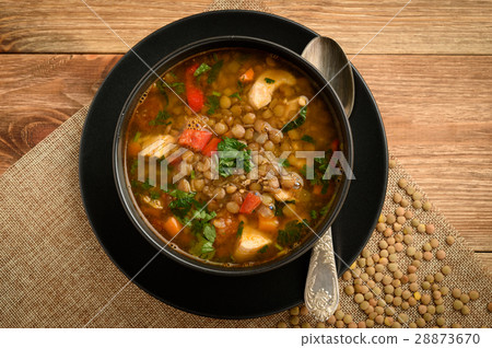 Soup with green lentil, chicken and vegetables. 28873670