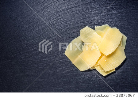 top view of tasty yellow thin slice parm cheese top view of tasty yellow thin slice parm cheese 28875067