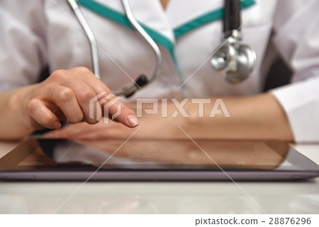 Female Doctor Examines X-ray Female Doctor Examines X-ray 28876296