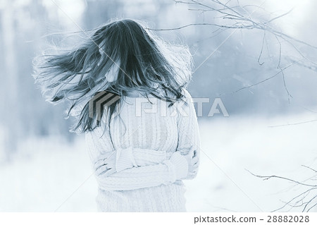 unusual toned portrait of a beautiful young girl in winter unusual toned portrait of a beautiful young girl in winter 28882028