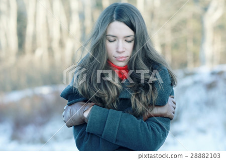 Winter portrait of a woman of stress 28882103