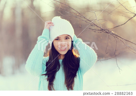 Spring portrait of a girl outside in a sweater Spring portrait of a girl outside in a sweater 28882163