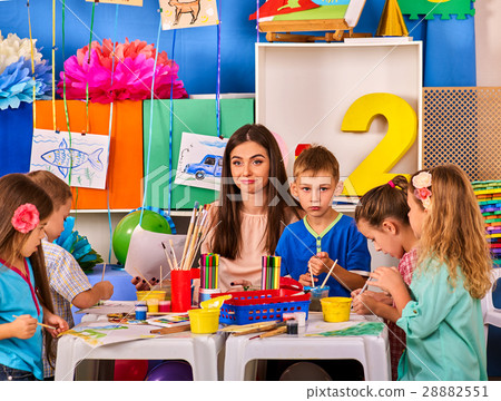 Children painting and drawing together . Craft 28882551