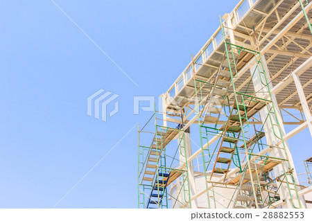 Construction workers working on scaffolding Construction workers working on scaffolding 28882553