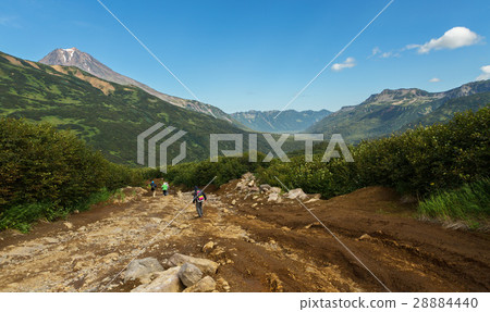 Tourists traveling along brookvalley Spokoyny at Tourists traveling along brookvalley Spokoyny at 28884440