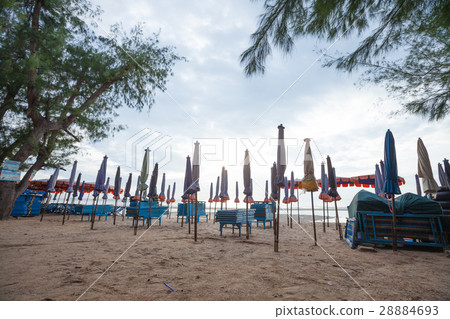 Beds and umbrellas on the beach. 28884693