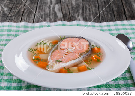 salmon soup with vegetables and dil on white dish salmon soup with vegetables and dil on white dish 28890058