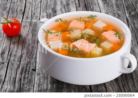 Hearty salmon chowder on white bowl with dill 28890064