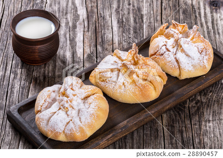 coconut puff pastries  with powdered sugar dusting 28890457
