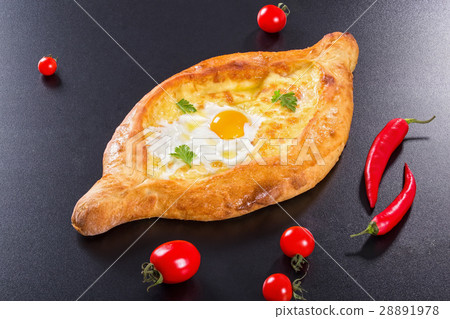 khachapuri with egg on black background 28891978