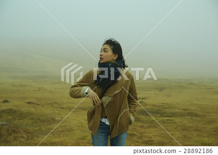 A woman going through the fog A woman going through the fog 28892186