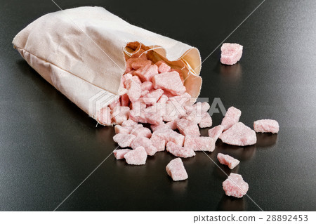 cherry flavored sugar chunks in bag on black cherry flavored sugar chunks in bag on black 28892453