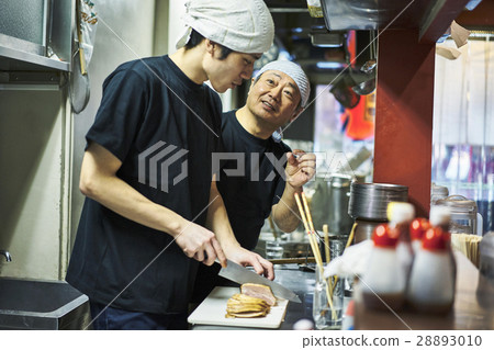 Store owner and clerk under training 28893010