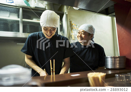 Store owner and clerk under training Store owner and clerk under training 28893012