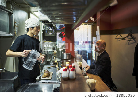 Men and clerks arriving at the counter 28893059