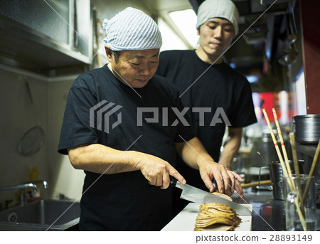 Store owner and clerk under training 28893149