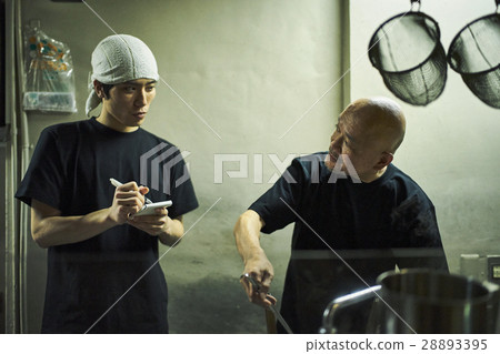 Store owner and clerk under training Store owner and clerk under training 28893395