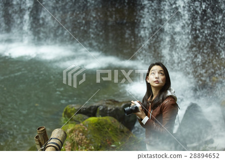 A woman enjoying clear stream 28894652