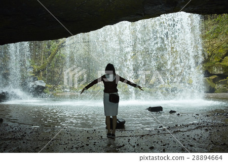 A woman enjoying clear stream 28894664