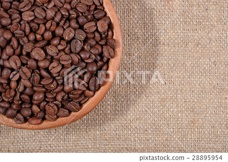 Coffee beans in a wooden bowl 28895954