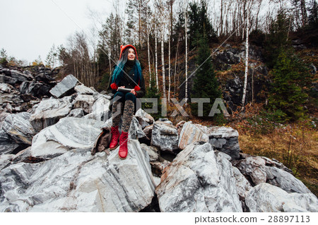 artist girl painting sitting on the rocks at the artist girl painting sitting on the rocks at the 28897113
