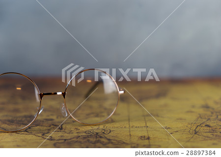 Explorer Glasses on vintage world map, for traveler concept Explorer Glasses on vintage world map, for traveler concept 28897384