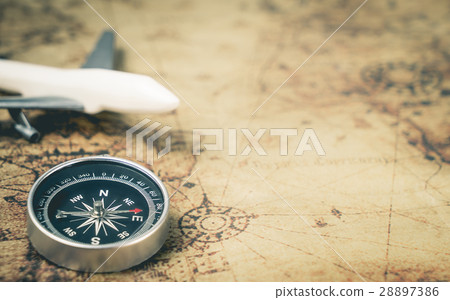 Retro Compass with toy airplane on Vintage world map for explorer concept with copy space 28897386