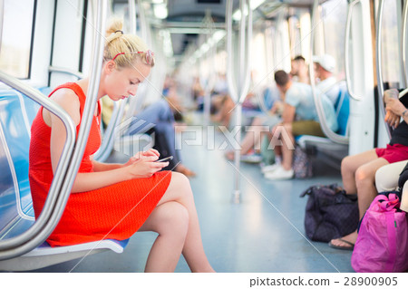 Lady traveling by metro. 28900905
