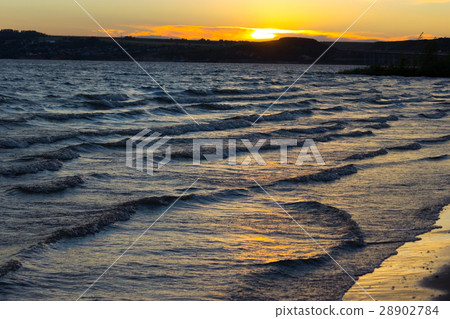 Scenic sunset over ocean beach 28902784