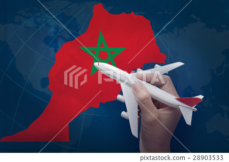 hand holding airplane with map of Morocco. 28903533